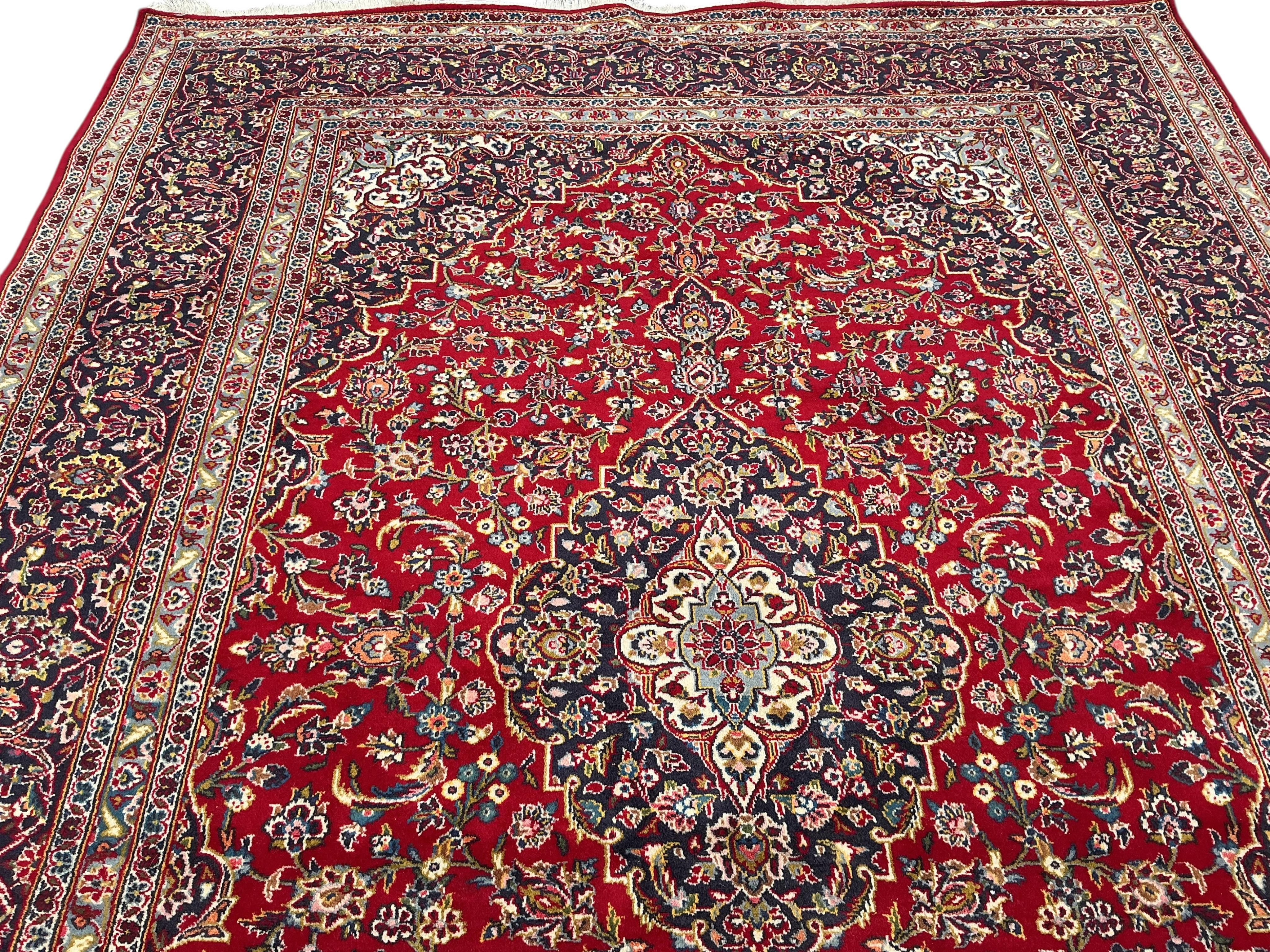 A Nadjafabad blue ground carpet, 346 x 248cm